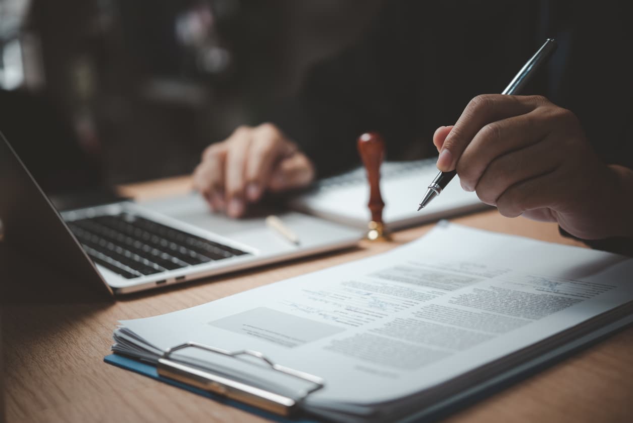 Immigration attorney reviewing case materials at a desk